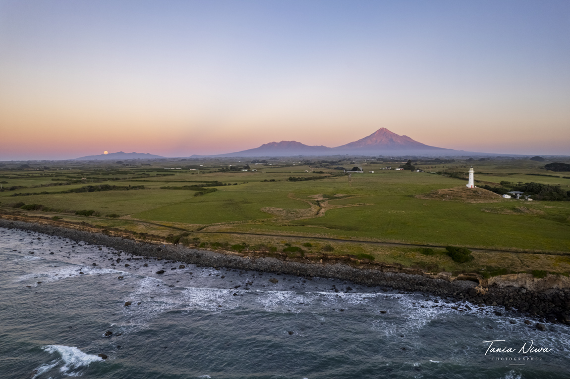 cape rd lighthouse full moon rising over Kaitake range with Mt Taranaki